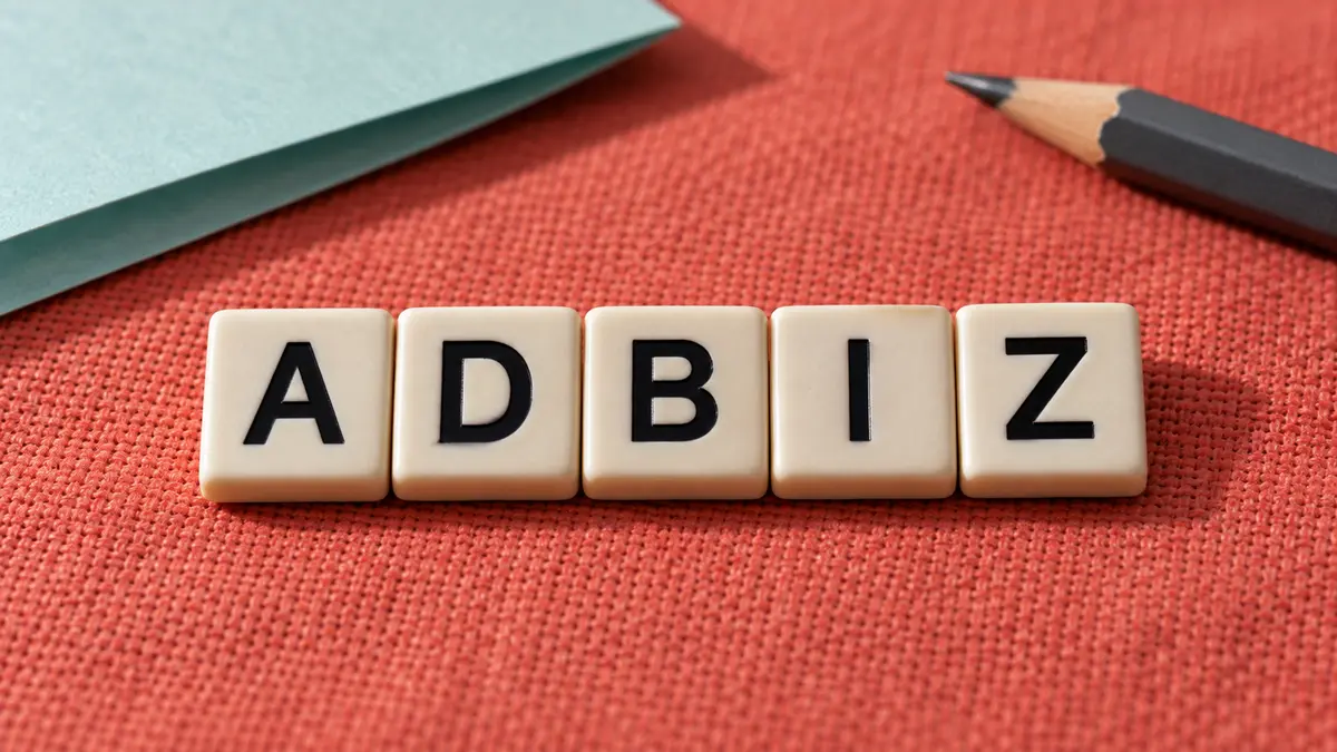 Five crossword tiles spelling ADBIZ